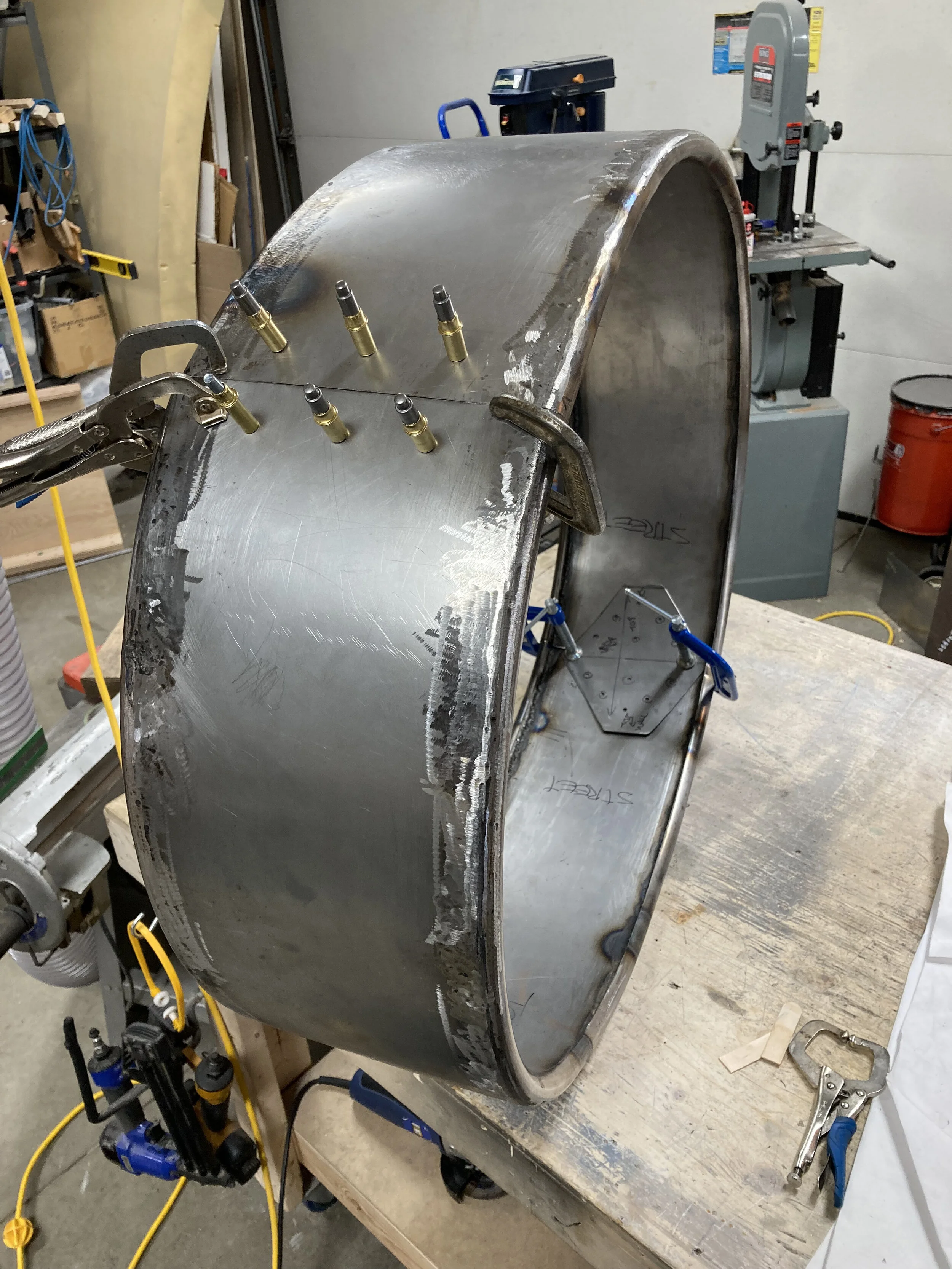 Fitting the two halves of the shell. Half of the shell will be permanently attached to the sign, while the outer half must be removable so logo panels can be inserted and changed in the future if required. An inner tab will underlap the shell and b