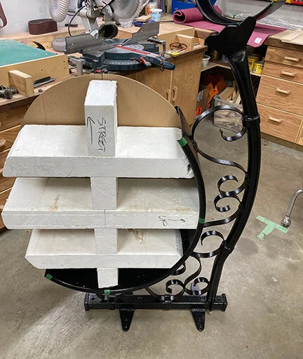 With powder coating complete, next was a solution to keep the logo panels in place and to give maximum resistance to wind gust. A rigid foam structure was fabricated so that any loads would be transferred to the opposing shell frame, which have high