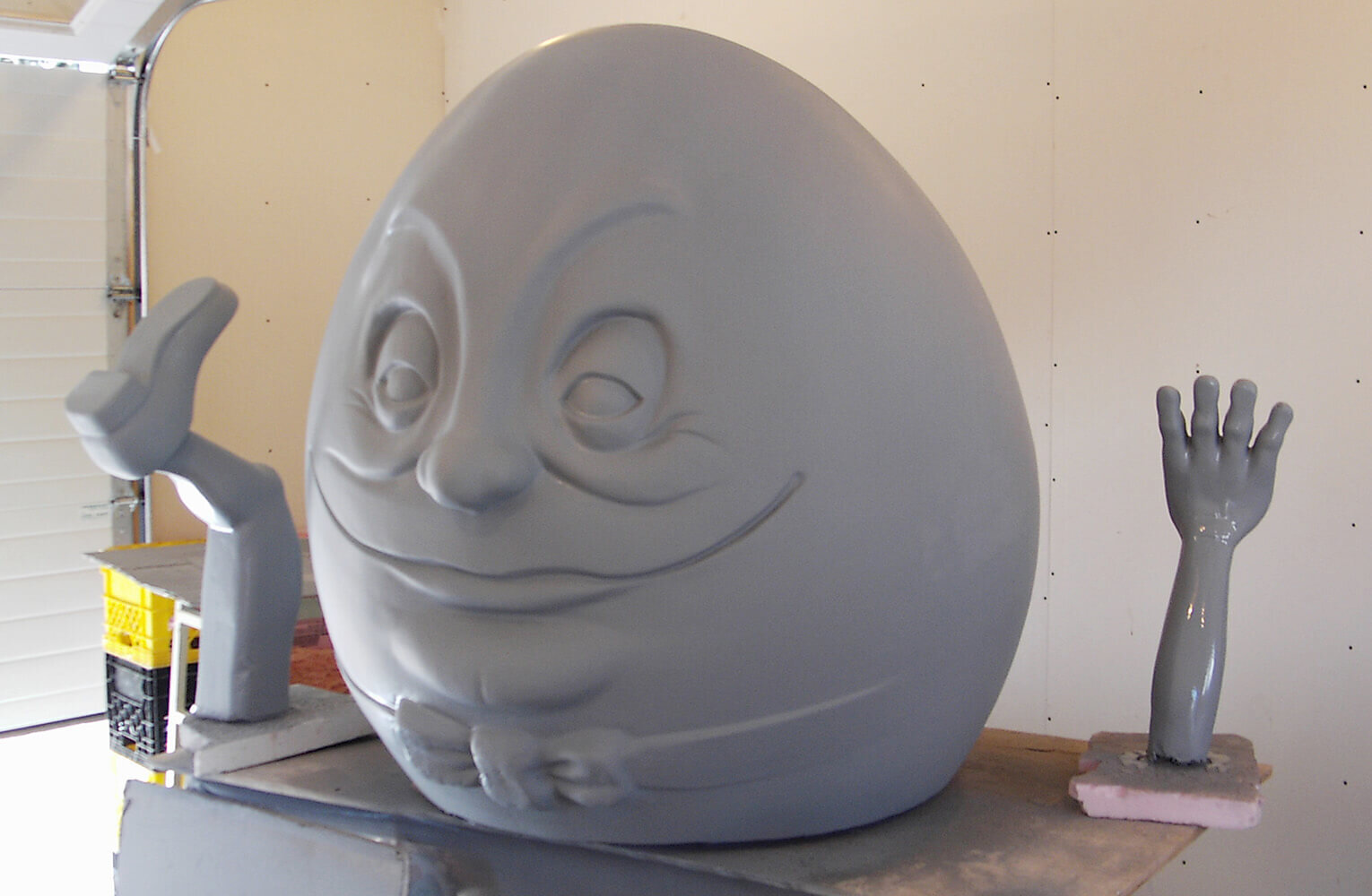 With carving complete, two layers of fibreglass and plenty of body filler were applied then finished with primer and gloss paint; this is the master figure and is called a 'plug’. It represents not the finished figures, but only the beginning.