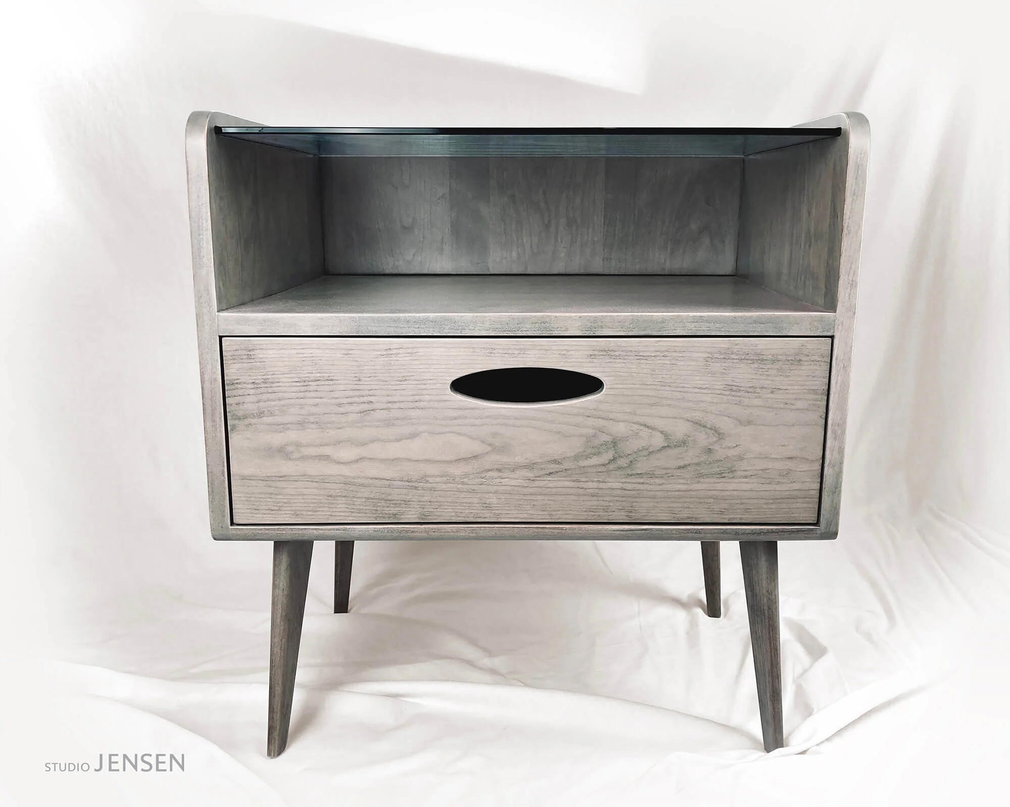 The Cole Table features dovetailed drawers and traditional blind dado joinery blending beauty and durability in a sleek marriage of mid century modern and contemporary design.