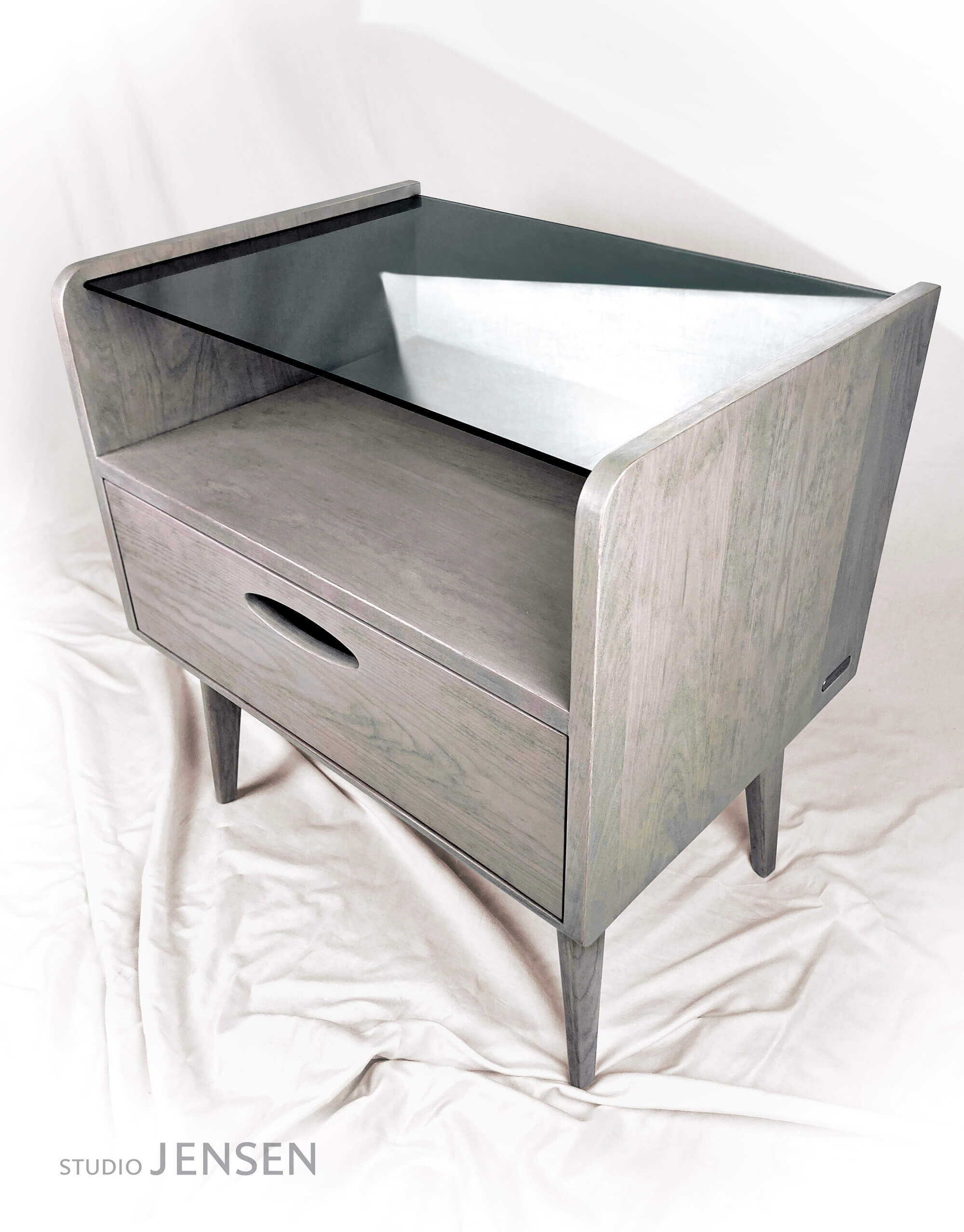 These low profile side tables are hand crafted from solid cherry hardwood with a custom white-tinted varnish over stain that we call ‘Danish Driftwood’.