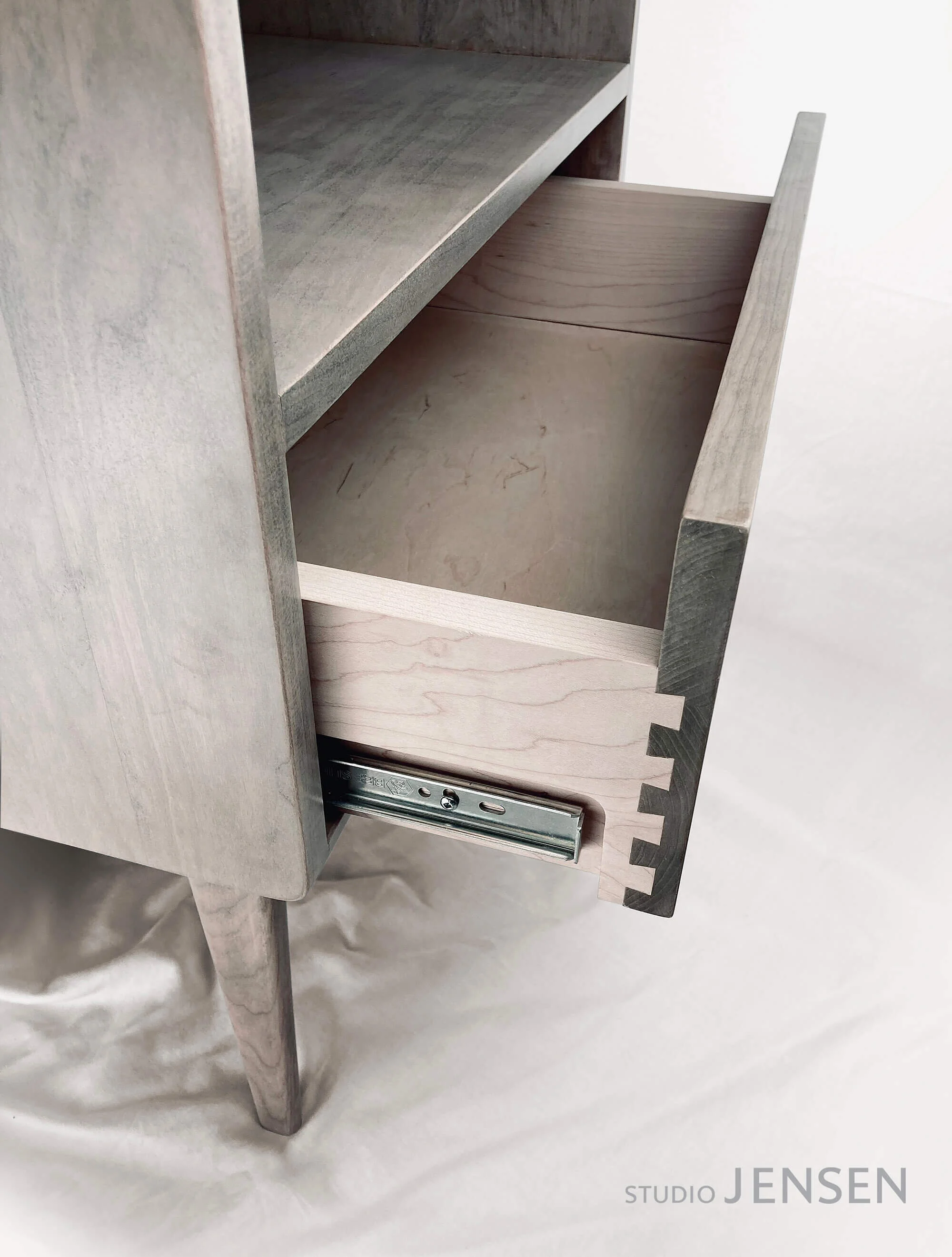 Dovetail and recessed slider detail - note the drawer sides are maple to contrast the cherry fronts which are pre-stained before assembly to enhance contrast.