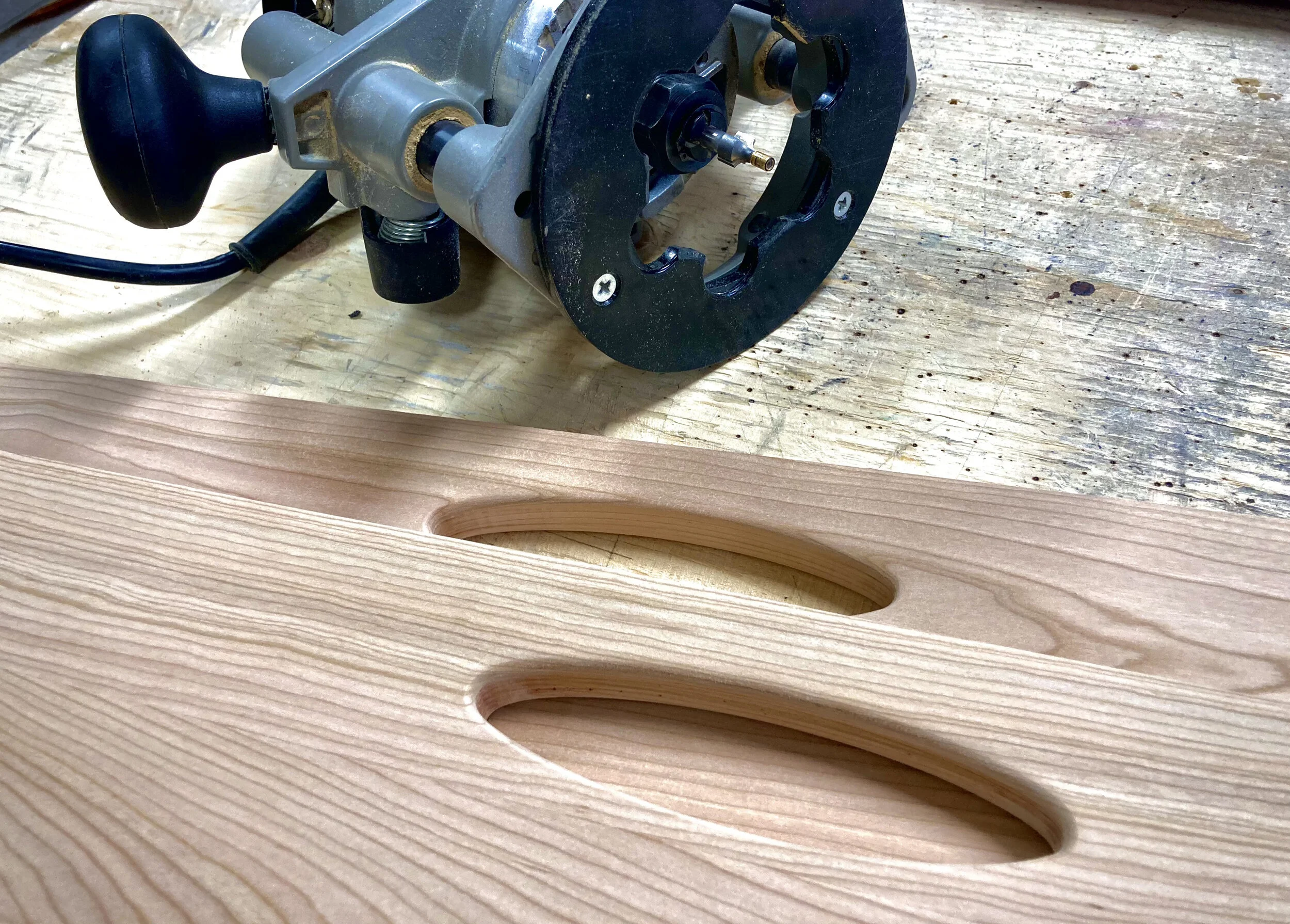 Drawer openings hand cut using templates - here the edges are rounded slightly with a router.