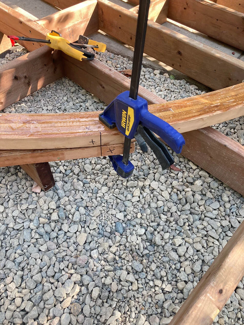 Here are semi-finished edge curves being fitted and positioned on the joists. The edge hasn't been sanded or planed yet and still has epoxy on the surface. West System Epoxy (slow cure) is used to laminate the strips instead of white glue, as it is p