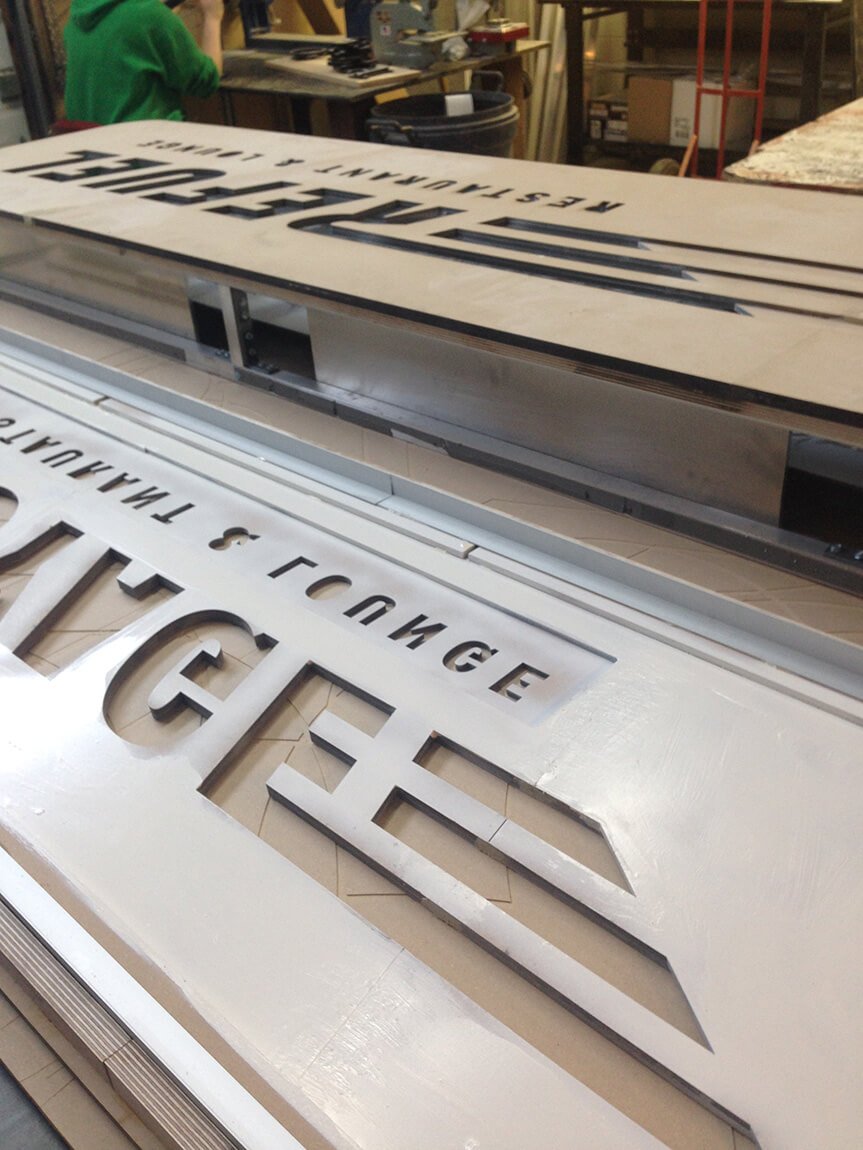 The lit side, once cut, is being fitted.