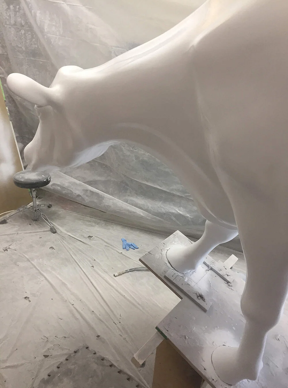 Here, Bessie is in her final stages of painting. We fabricated a giant spray booth for the shop to accommodate such a large project, which included simultaneous spraying of the buildings for the cityscape. This a LONG way from her humble beginnings….